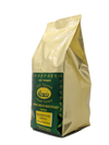Gold coffee bag with green label featuring 'Old Tyme Coffee Estate' on a white background. which is teasing a new website coming soon