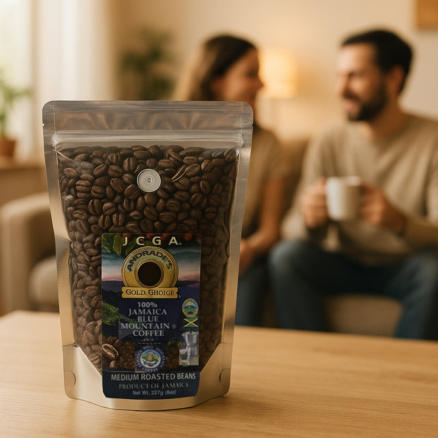 Bag of JCGA Jamaica Blue Mountain coffee beans on a table with a blurred background of a couple enjoying coffee. Organic coffee beans, father day gift for father, birthday gift trends, best coffee beans, best gift ideas, purist coffee, fresh coffee beans, gift for coffee lovers, best coffee beans top selling coffee beans, coffee lovers, coffee gift ideas, single estate, mother day gift 2026, birthday gift 2025, Jamaica Blue Mountain coffee, great birthday gift, best coffee gift, mother day gift for mom, top