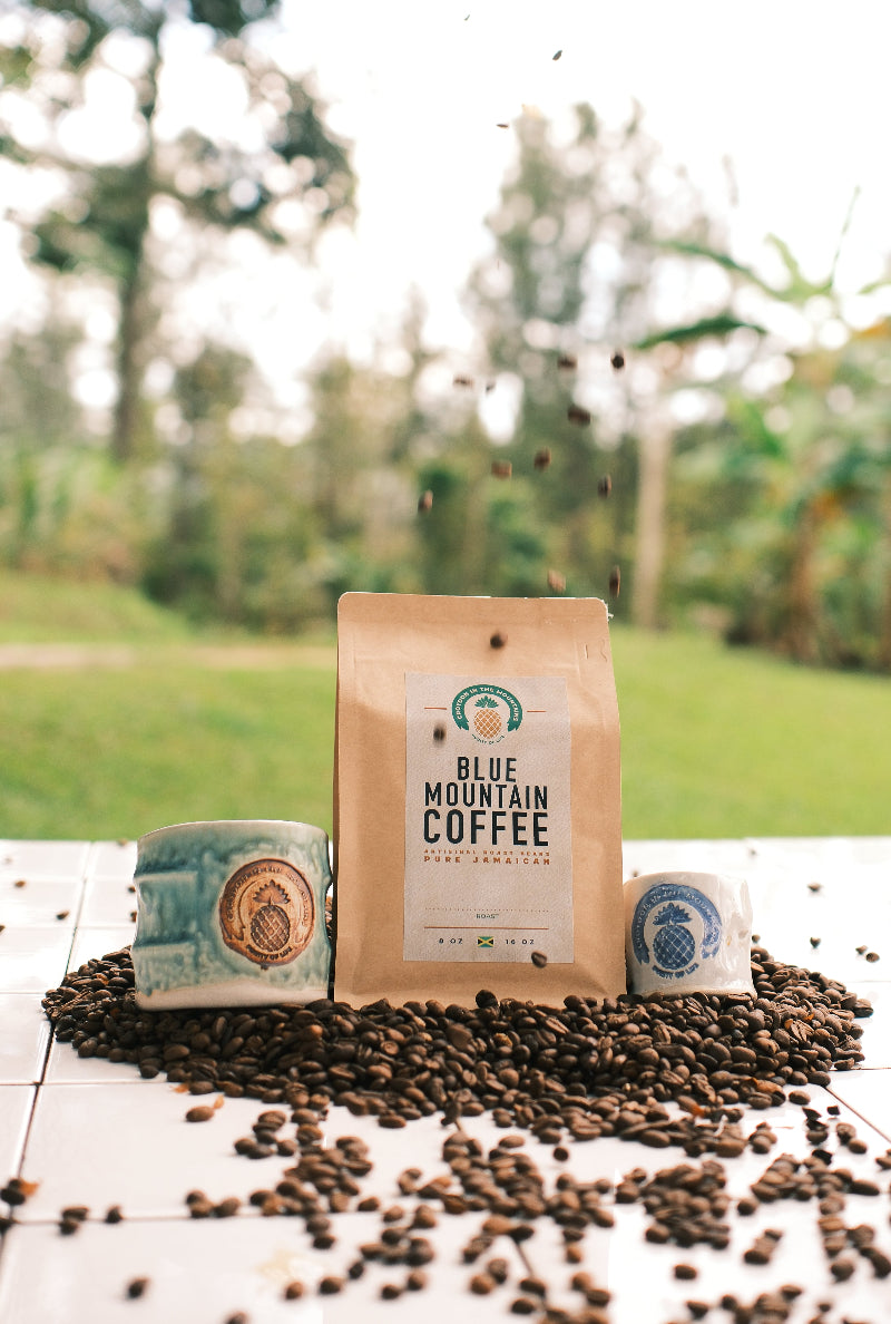 Blue Mountain Coffee package with coffee beans on a wooden surface with a blurred natural background